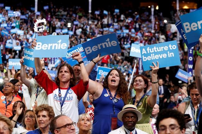 Delegates cheer as Former Democratic Presidential candidate Sen. Bernie Sanders I-Vt. speaks during the first day of the Democratic National Convention in Philadelphia, Monday