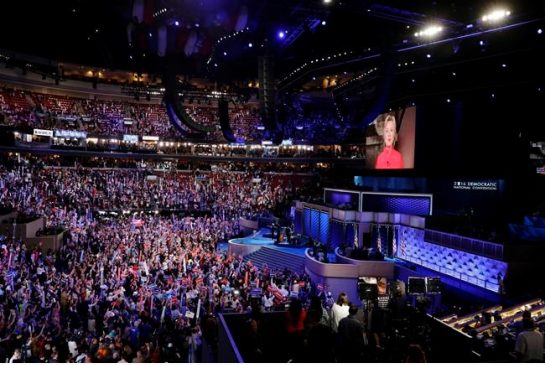 Democratic Presidential candidate Hillary Clinton appears son the screen during the second day session of the Democratic National Convention in Philadelphia Tuesday