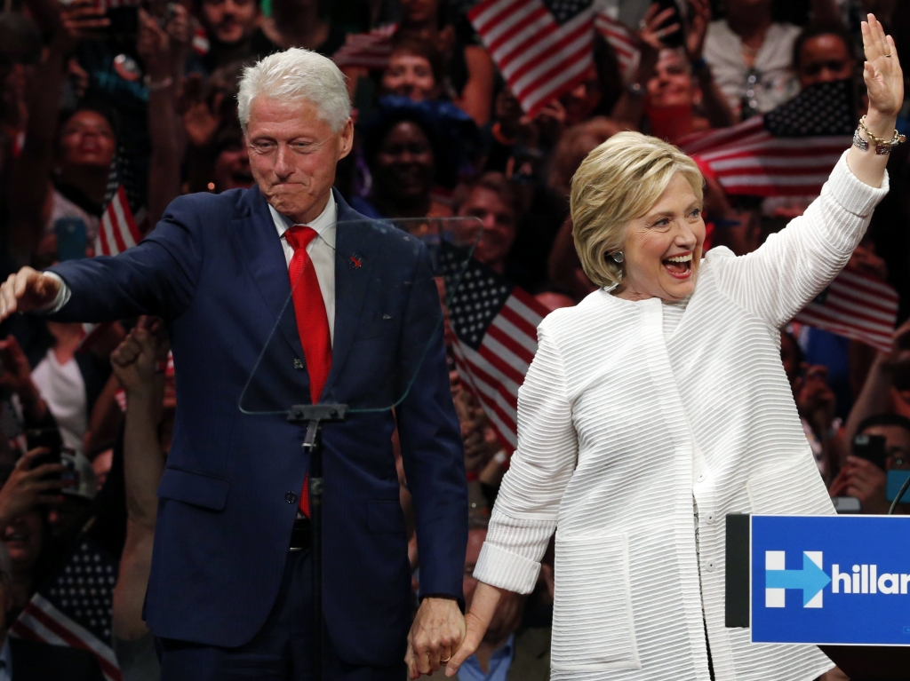 Bill and Hillary Clinton campaigning together at a rally in New York in June.			Julio Cortez  AP