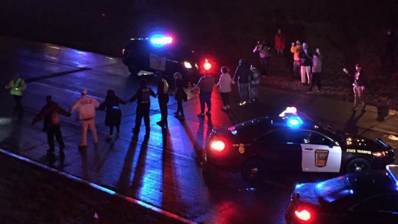 People are protesting the shooting death of a black man Alton Sterling by two white police officers at a convenience store parking lot last week. (Scott Clause  The Daily A