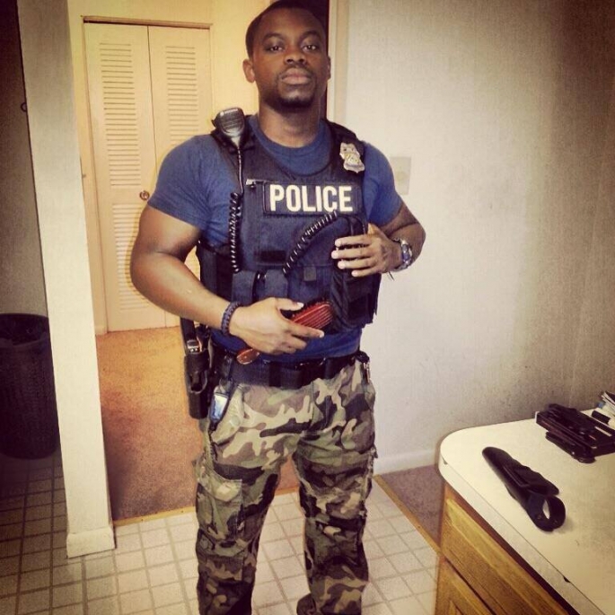 Black police Jay Stalien is wearing his law enforcement uniform protection