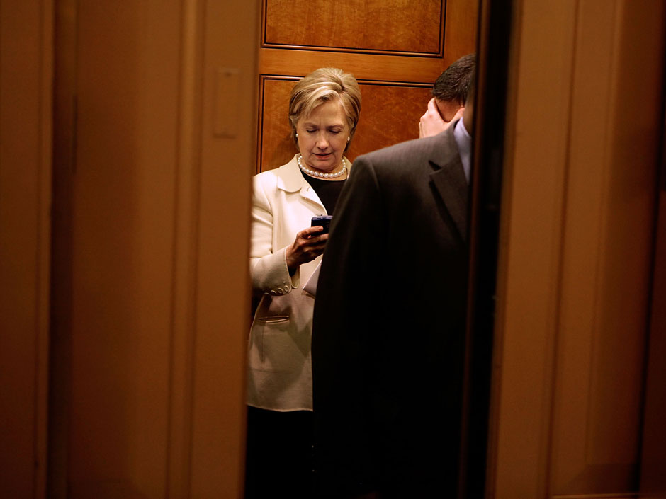 Then-Senator Hillary Clinton checks her Black Berry in 2009. The U.S. Senate says it will no longer offer the devices to senators