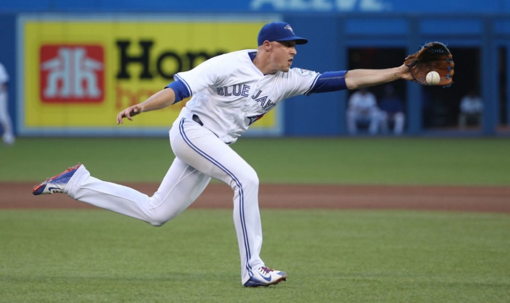 Jays starter Aaron Sanchez chases down an infield single off the bat of Alex Dickerson of the Padres in the fourth inning