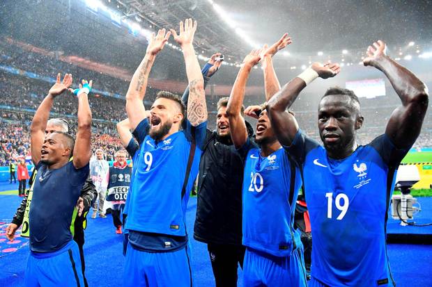 Blue heaven French players celebrate their victory over Iceland last night