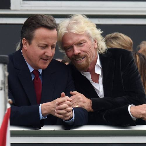 Minister David Cameron left and Virgin boss Richard Branson talk at the Farnborough International Airshow in Farnorough south England Monday