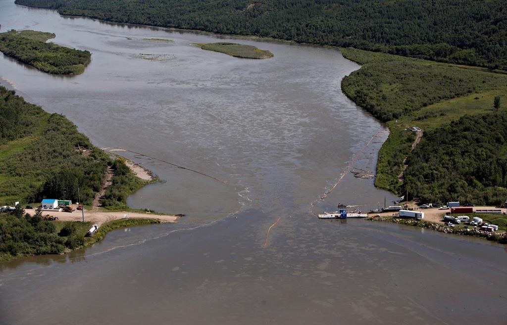 Booms attempt to contain oil from Husky Energy's pipeline spill