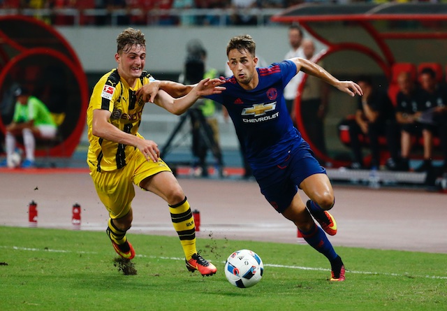 Borussia Dortmund's Jacob Bruun Larsen in action with Manchester United's Adnan Januzaj. Reuters