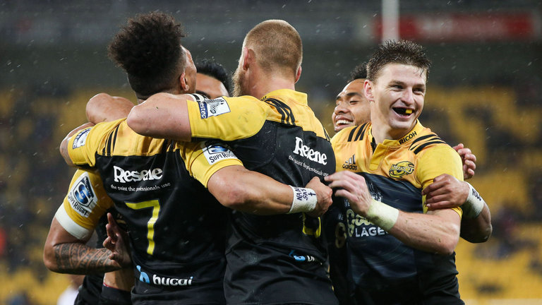 Brad Shields is congratulated by team-mates after his try