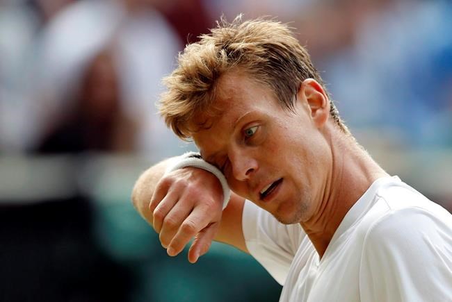 FILE- Another top 10 tennis player has withdrawn from the Rio de Janeiro Olympics over concerns about the Zika virus. Tomas Berdych of the Czech Republic wipes his face during his men's semifinal singles match against Andy Murray of Britain duri