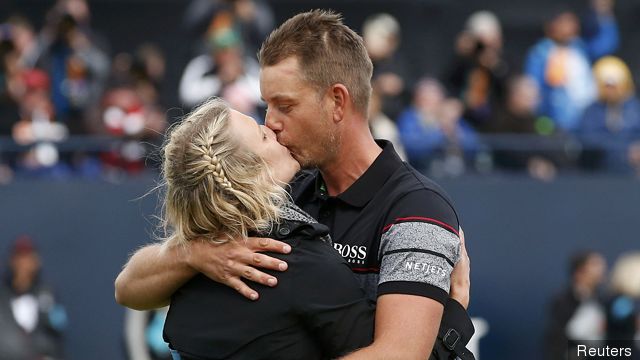 Sweden's Henrik Stenson kisses his wife Emma after winning the British Open golf championship at Royal Troon Scotland