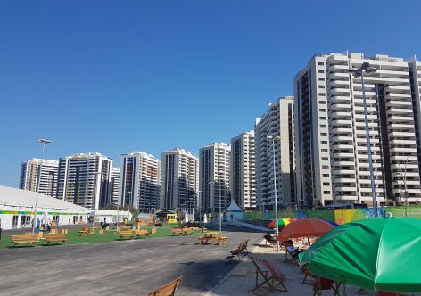 Buildings like Australia's second from left were not ready at the opening of the village