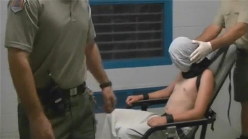 CCTV footage from the Don Dale Youth Detention Centre shows a boy hooded and strapped to a mechanical chair