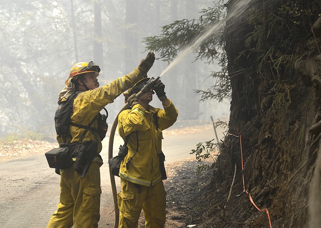 The Latest: Evacuees return, but California wildfire rages