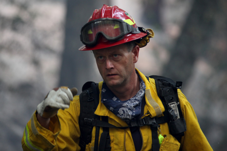 Firefighters battle California wildfires, bulldozer operator dies