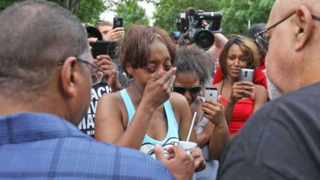 Diamond Reynolds weeps after she recounts the incidents that led to the fatal shooting of her boyfriend Philando Castile by Minneapolis area police during a traffic stop on Wednesday at a'Black Lives Matter demonstration in front of the Governor's Man