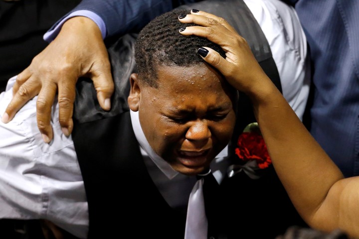 Cameron Sterling is consoled after the funeral of his father Alton Sterling in Baton Rouge Louisiana