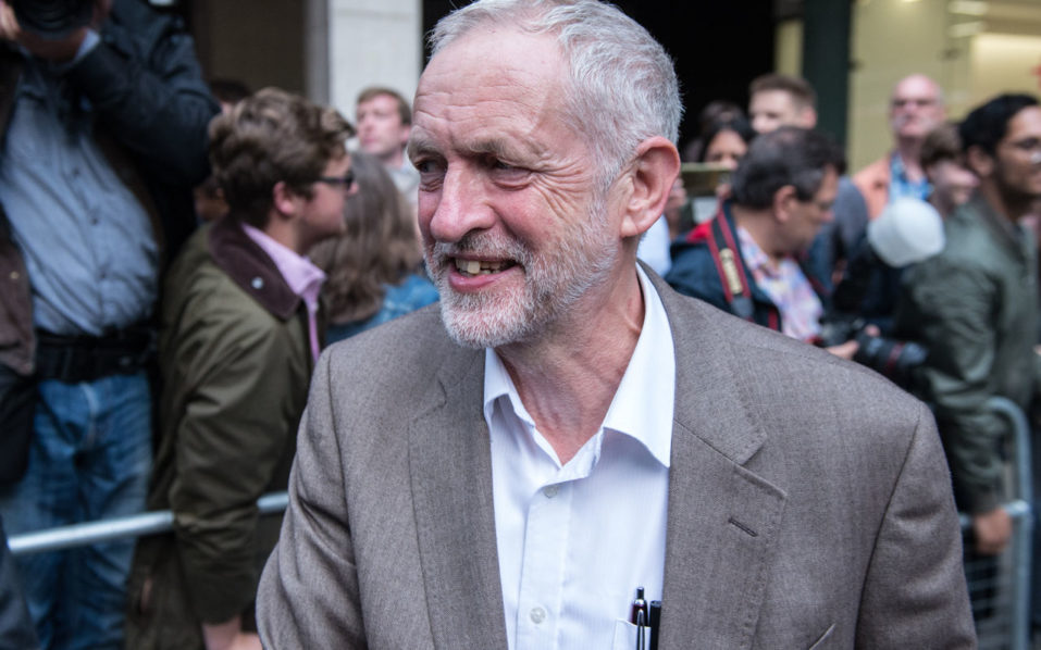 British Opposition Labour Party leader Jeremy Corbyn smiles as he meets supporters and members of the media after attending a meeting of Labour's National Executive Committee in London