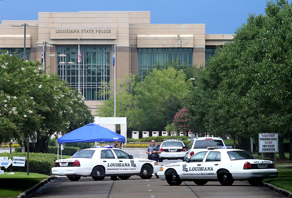 BATON ROUGE LA- JULY 17 Law enforcement officers block the entrance to the Louisiana State Police headquarters after 3 police officers were killed early this morning