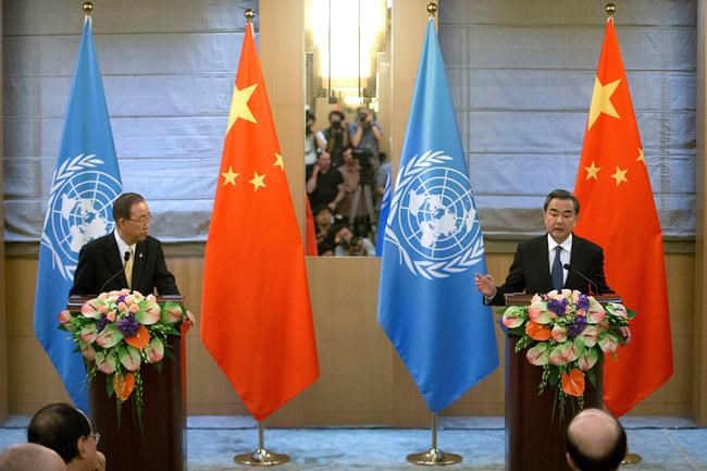 Chinese Foreign Minister Wang Yi right speaks during a joint press conference with U.N. Secretary General Ban Ki-moon at the Diaoyutai State Guesthouse in Beijing Thursday