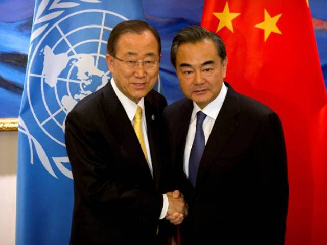 UN Secretary General Ban Ki-moon left shakes hands with Chinese Foreign Minister Wang Yi right at the Diaoyutai State Guesthouse in Beijing Thursday