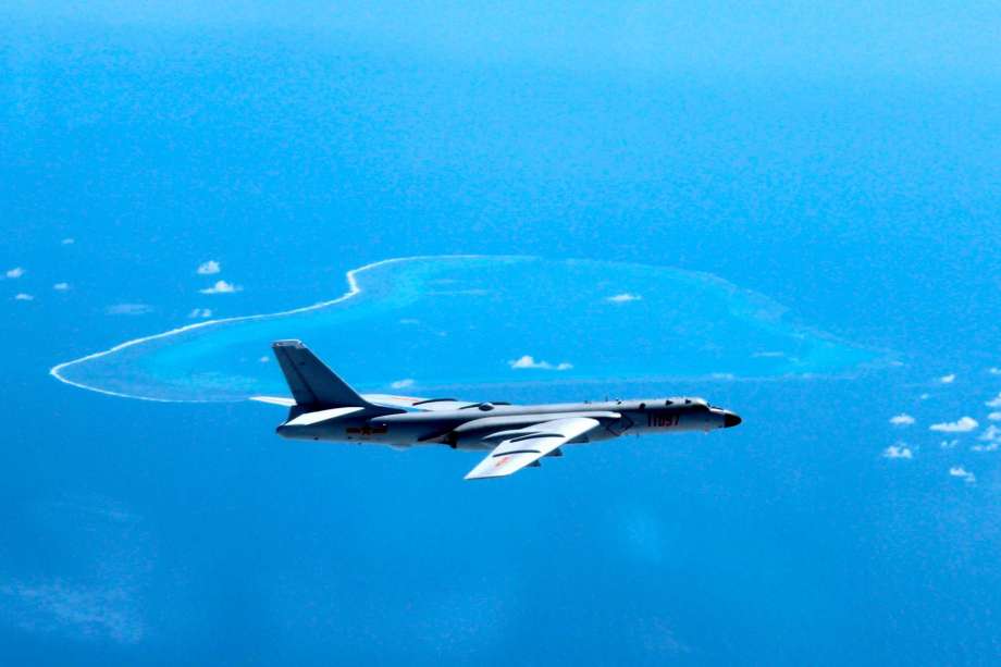 News Agency a Chinese H-6K bomber patrols the islands and reefs in the South China Sea. China is closing off a part of the South China Sea for military exercises this week the government said Monday