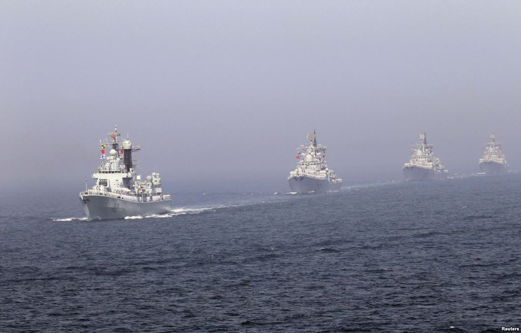 Chinese missile destroyers navigate during a joint China Russia naval exercise in the Yellow Sea in April 2012