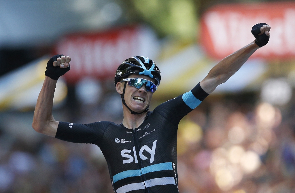 Britain ™s Chris Froome celebrates as he crosses the finish line to win the eighth stage of the Tour de France cycling race over 184 kilometers with start in Pau and finish in Bagneres-de-Luchon France Saturday