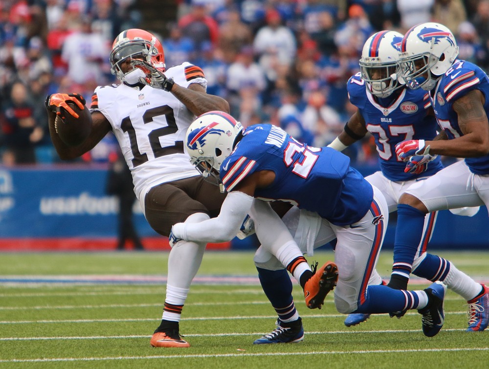 30 November 2014 Cleveland Browns wide receiver Josh Gordon is tackled by Buffalo Bills free safety Aaron Williams during a NFL game between the Cleveland Browns and Buffalo Bills at Ralph Wilson Stadium in Orchard Park NY