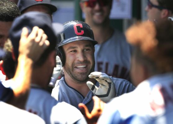 Cleveland Indians Jason Kipnis celebrates with teammates after