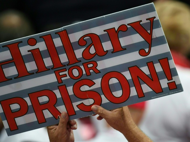 A sign against Democratic presidential candidate Hillary Clinton seen on the convention floor at the Republican National Convention