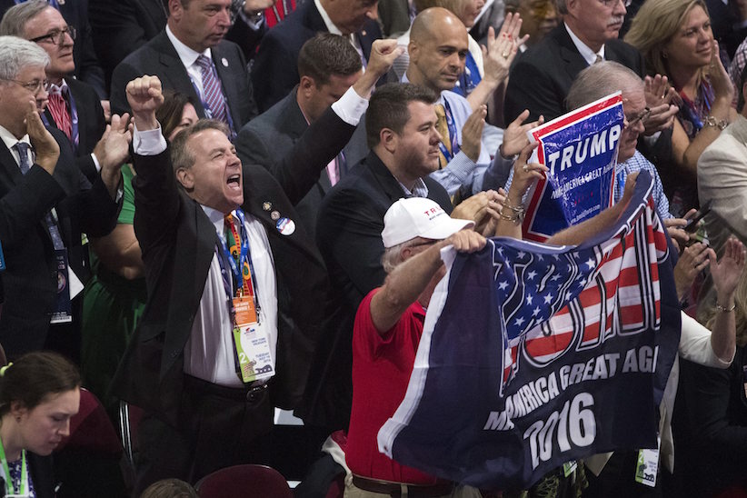 Members of the New York delegation cheer for Republican presidential candidate Donald Trump during the roll call at the Republican National Convention Tuesday