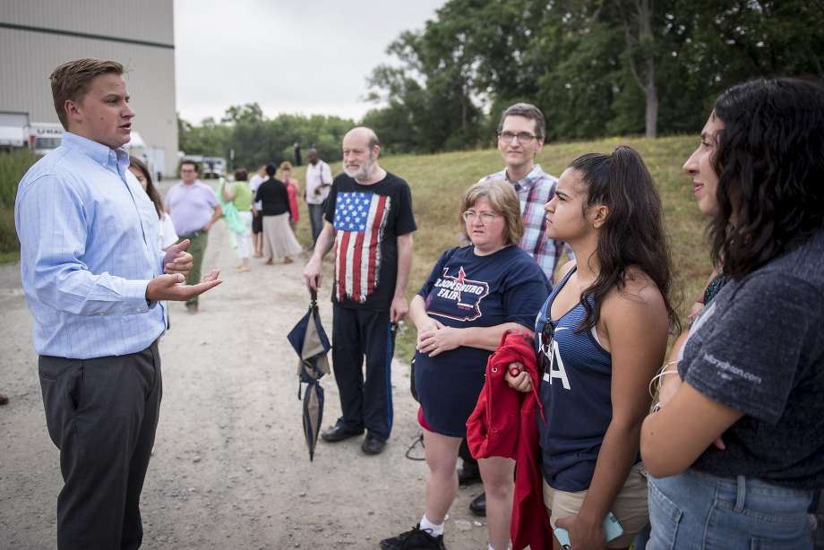 A campaign volunteer for Hillary Clinton informs attendees that the rally she had scheduled with Vice President Joe Biden in Scranton Pa. was being postponed after the Dallas shootings