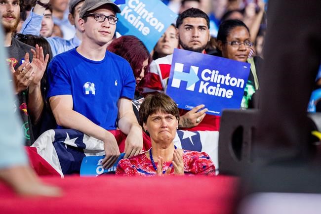 Anne Holton center the wife of Sen. Tim Kaine D-Va. becomes emotional as Kaine tells the audience that their son will be deployed to Europe as a Marine as he speaks at a rally with Democratic presidential candidate Hillary Clinton at Florida Internati