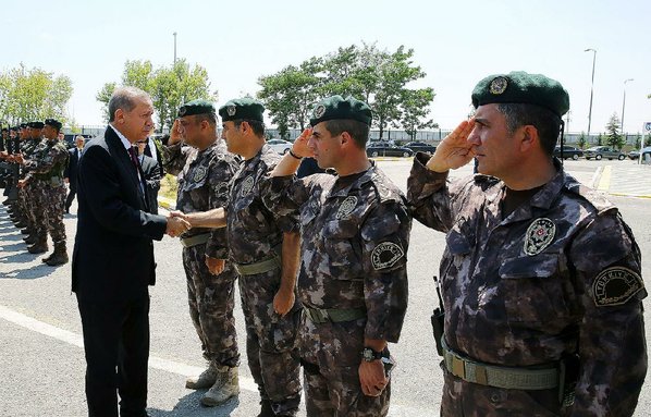 Credit AP				Turkey President Recep Tayyip Erdogan visits Friday with officers of the police special forces at their headquarters in Ankara