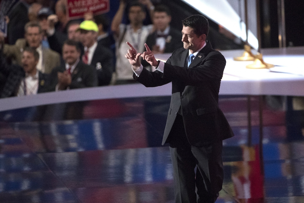 Speaker of the House Rep. Paul Ryan R-Wis. gestures and makes a 'W&apos for Wisconsin after speaking during the Republican National Convention Tuesday