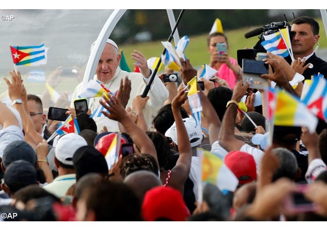 Cubans greeting Pope Francis when he arrived to celebrate Mass in Havana during his visit to the island in 2015- AP