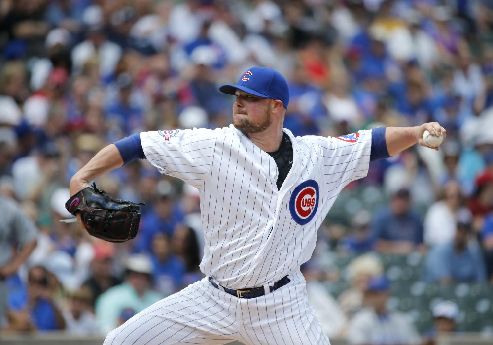 Chicago Cubs starting pitcher Jon Lester delivers during the first inning of a baseball game against the Seattle Mariners Friday