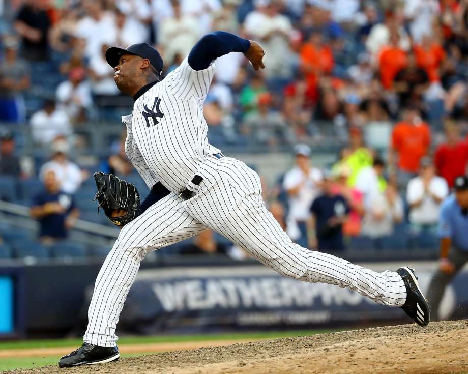 NEW YORK NY- JULY 23 Aroldis Chapman #54 of the New York Yankees delivers a pitch in the ninth inning against the San Francisco Giants