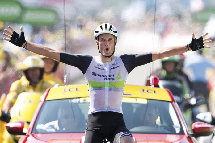 Britain’s Stephen Cummings crosses the finish line to win the seventh stage of the Tour de France cycling race in Lac de Payolle France Friday July 8