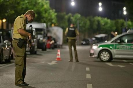 DANIEL KARMANN  EPA		A policeman with a machine gun stood guard in Ansbach Germany