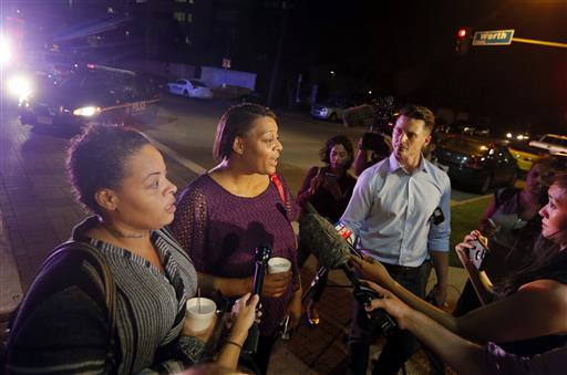 Sherie Williams left and Theresa Williams center speak to the media as they leave the Baylor University Medical Center Friday