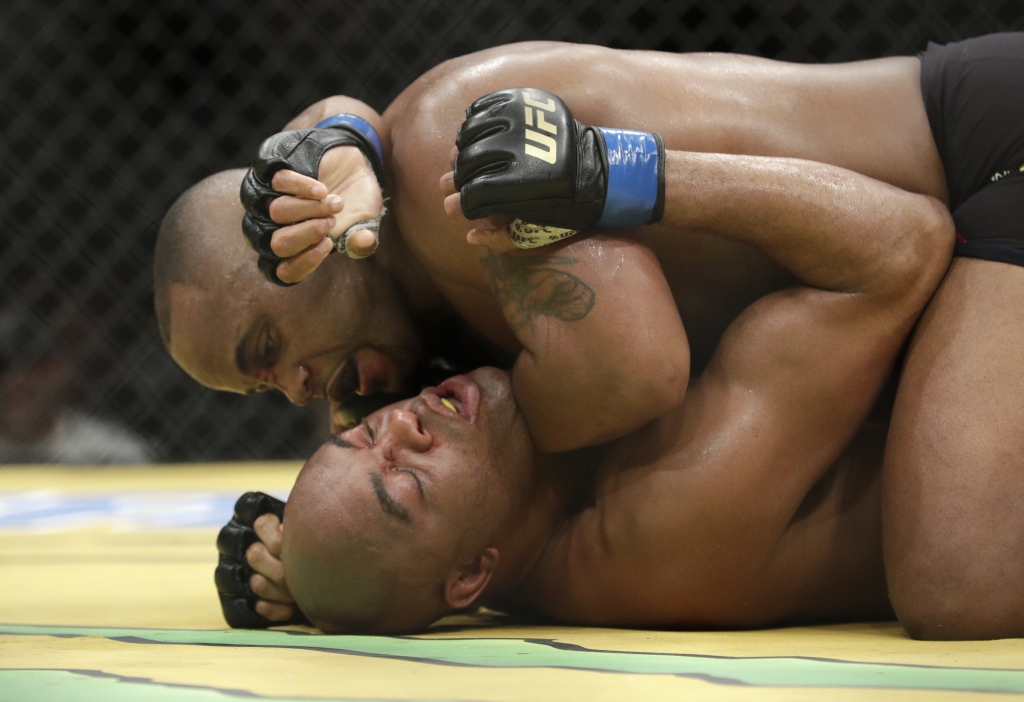 Daniel Cormier top fights Anderson Silva during their light heavyweight mixed martial arts bout at UFC 200 Saturday