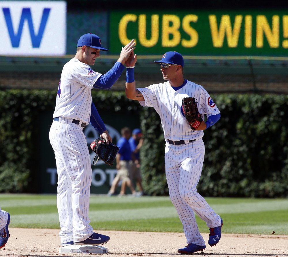 Anthony Rizzo left of the Chicago Cubs greets Albert Almora Jr. after the Cubs beat the Texas Rangers 3-1 in an interleague game Saturday in Chicago