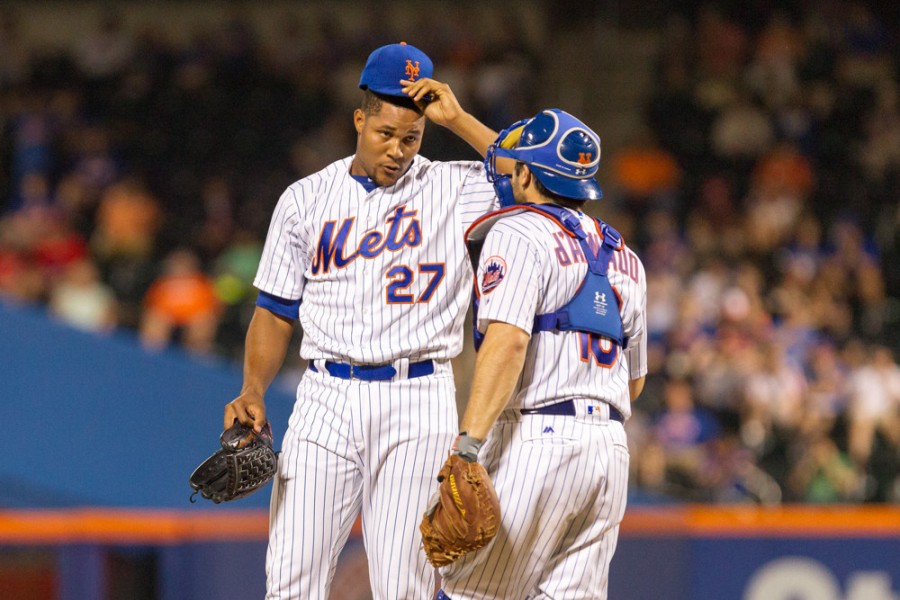 New York Mets catcher Travis d'Arnaud heads out to the mount to talk to Jeurys Familia during a National League East match-up between the first place Washington Nationals and the New York Mets at Citi Field in Flushing NY