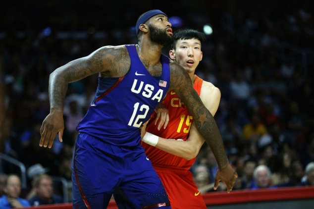 DeMarcus Cousins of team USA fights for position against China's Zhou Qi during the exhibition game at Staples Center