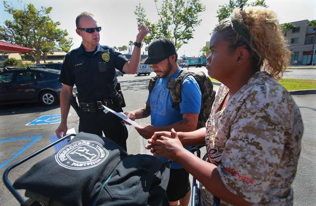 San Diego Homeless Outreach Team officer Brian Lucchesi canvasses several areas in the Midway and Sports Arena Blvd. area Wednesday