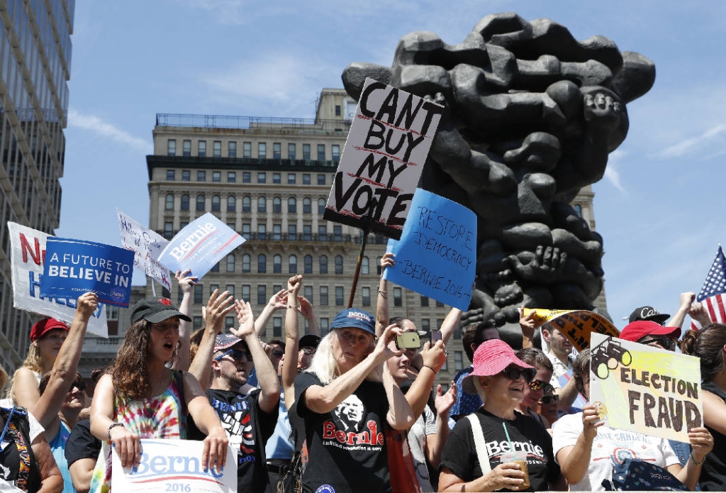 Berning with anger, protesters take Philadelphia streets ahead of Democratic convention