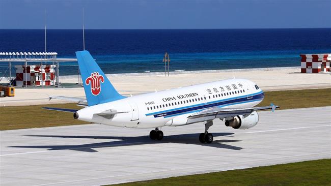 China Southern Airlines jetliner lands at the airfield on Fiery Cross Reef known as Yongshu Reef in Chinese in the Spratly Islands