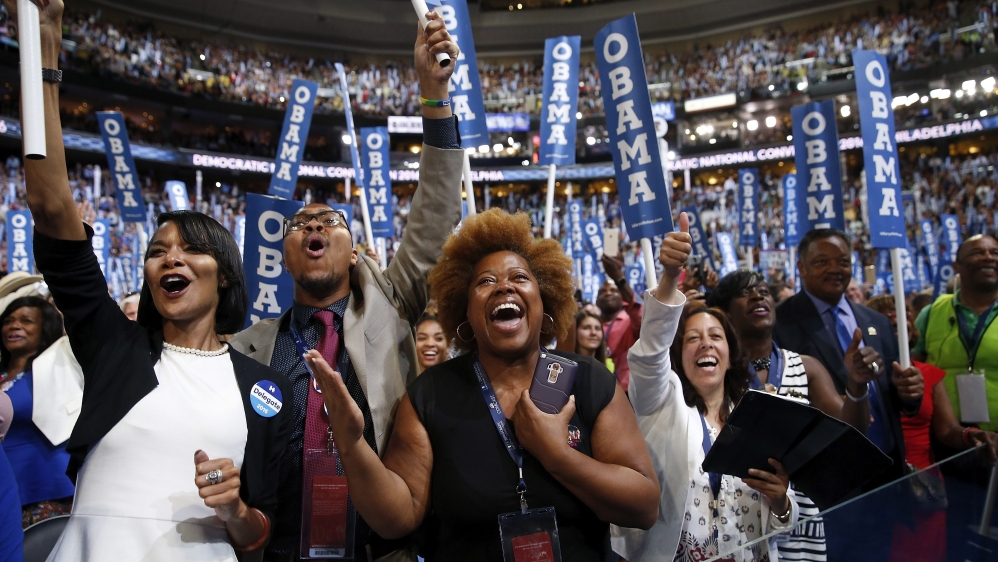 Delegates cheer as Obama addresses the Democratic National Convention