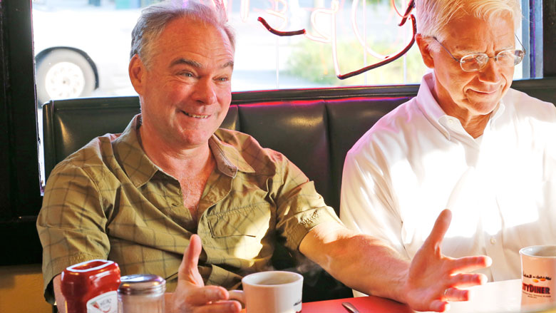 Democratic vice presidential candidate Sen. Tim Kaine D-Va. left talks with friends as he has breakfast at a diner in Richmond Va. Tuesday